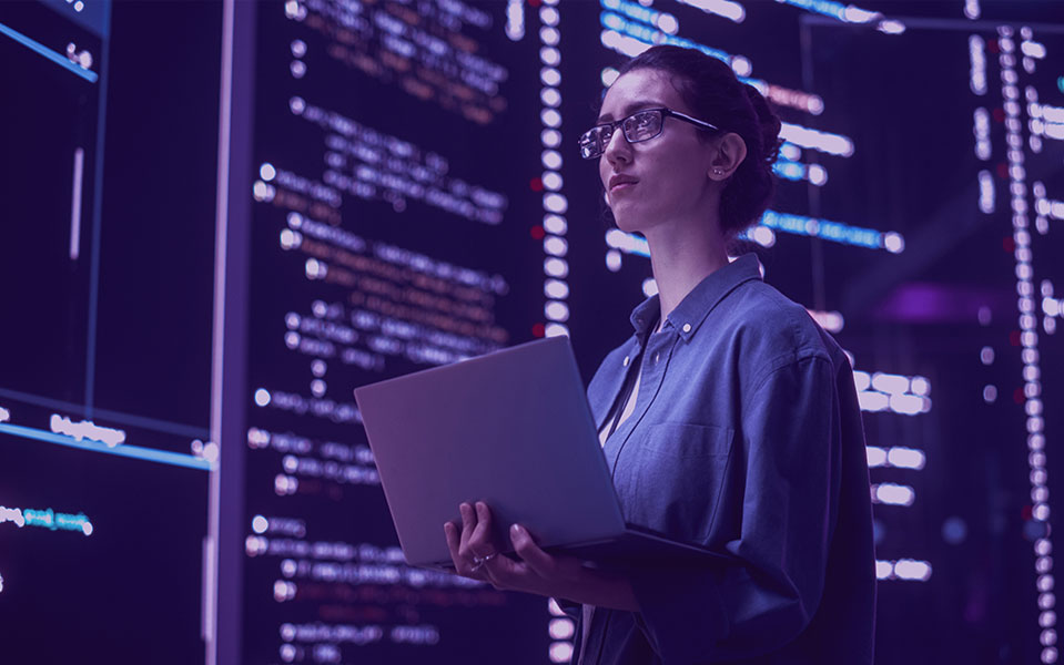 woman with laptop in a data center