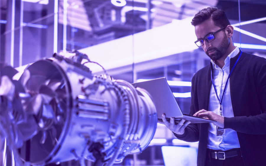 engineer with laptop in an industrial plant