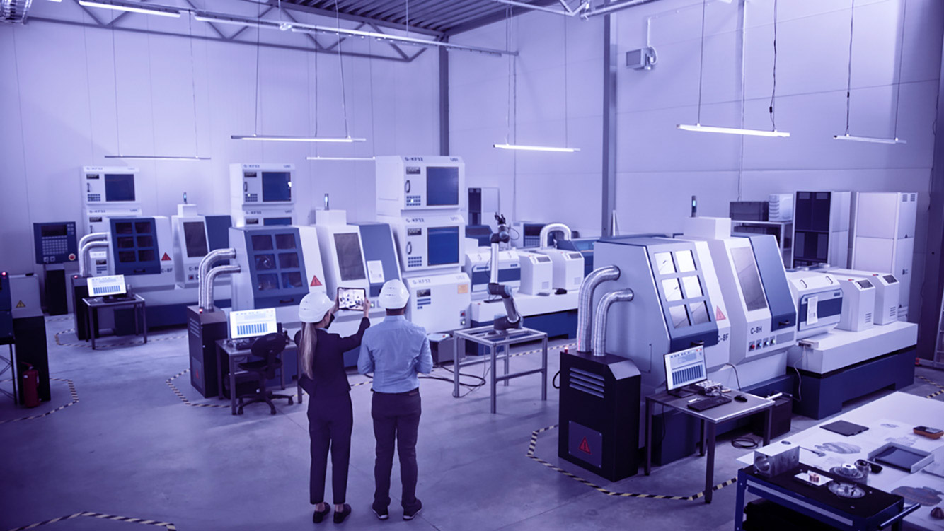 two engineers collaborating in a modern factory