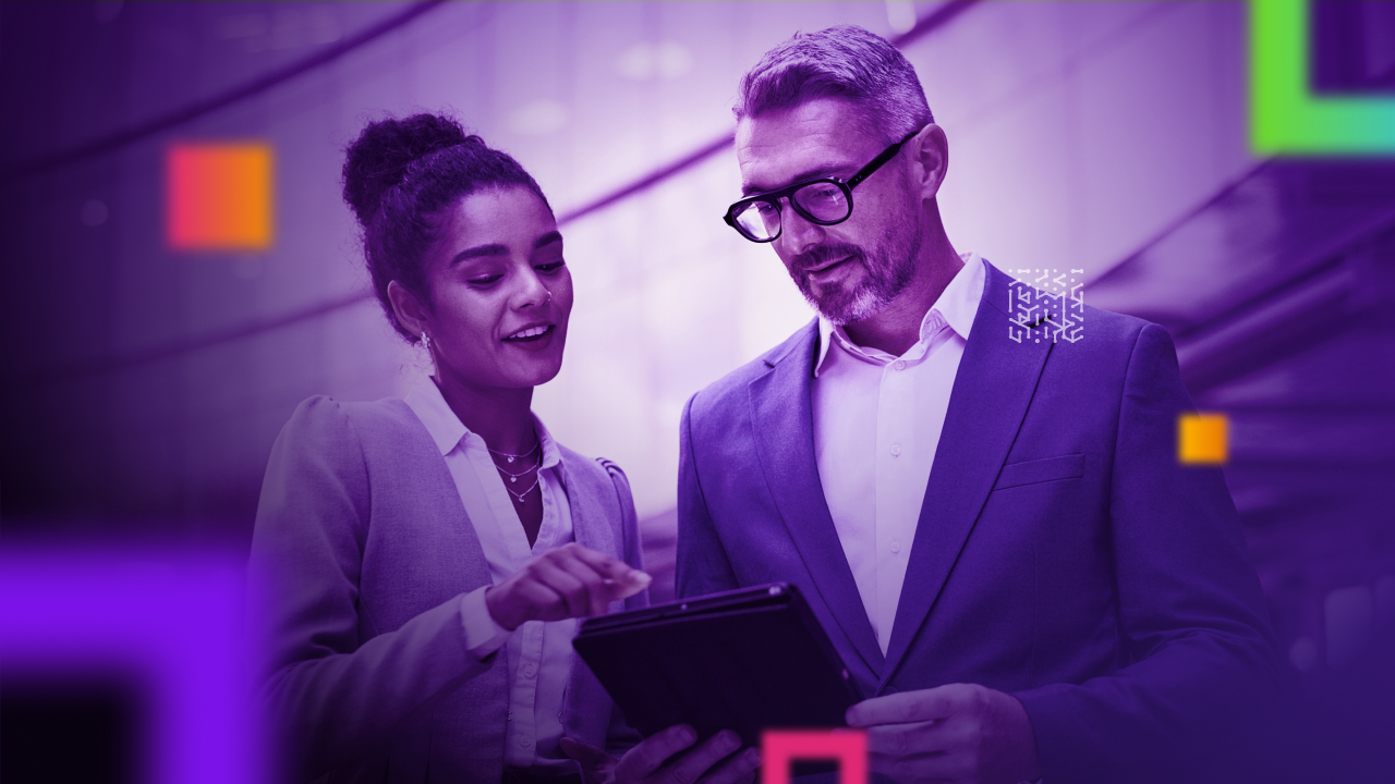 business people collaborating, looking at a tablet